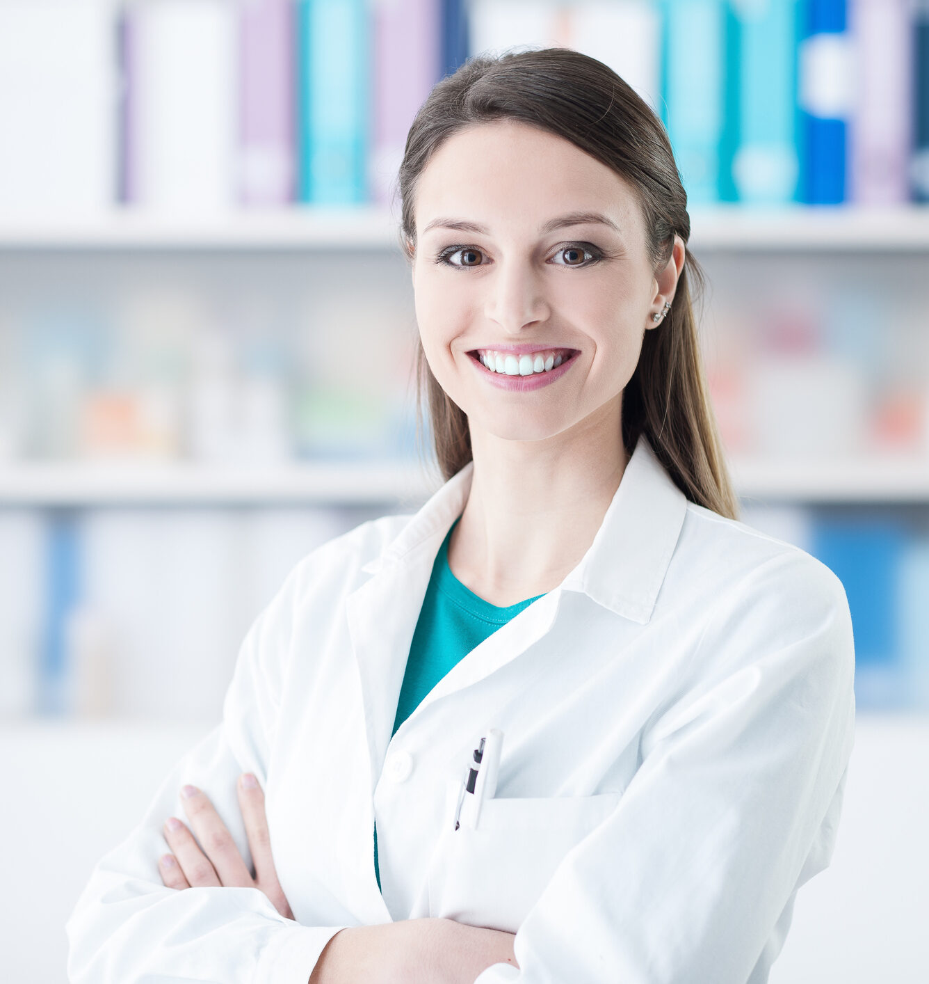 Confident smiling female doctor posing in the office, healthcare concept